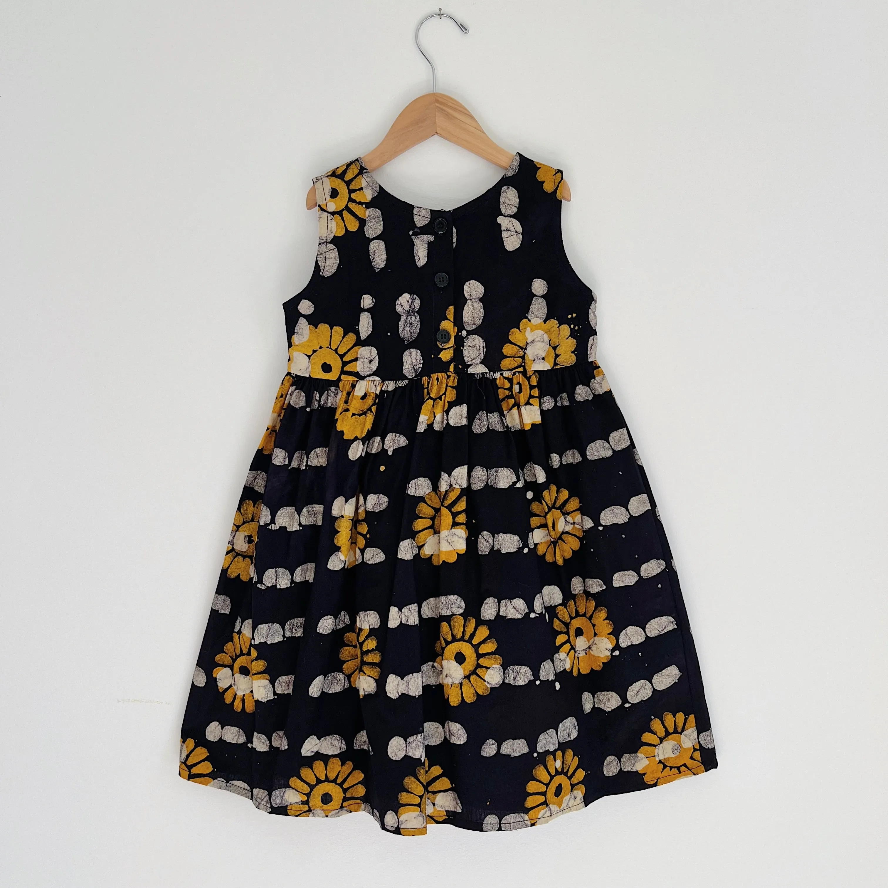 Fahari Bazaar | Girls Tank Dress in Yellow Sunflower Over Navy Print