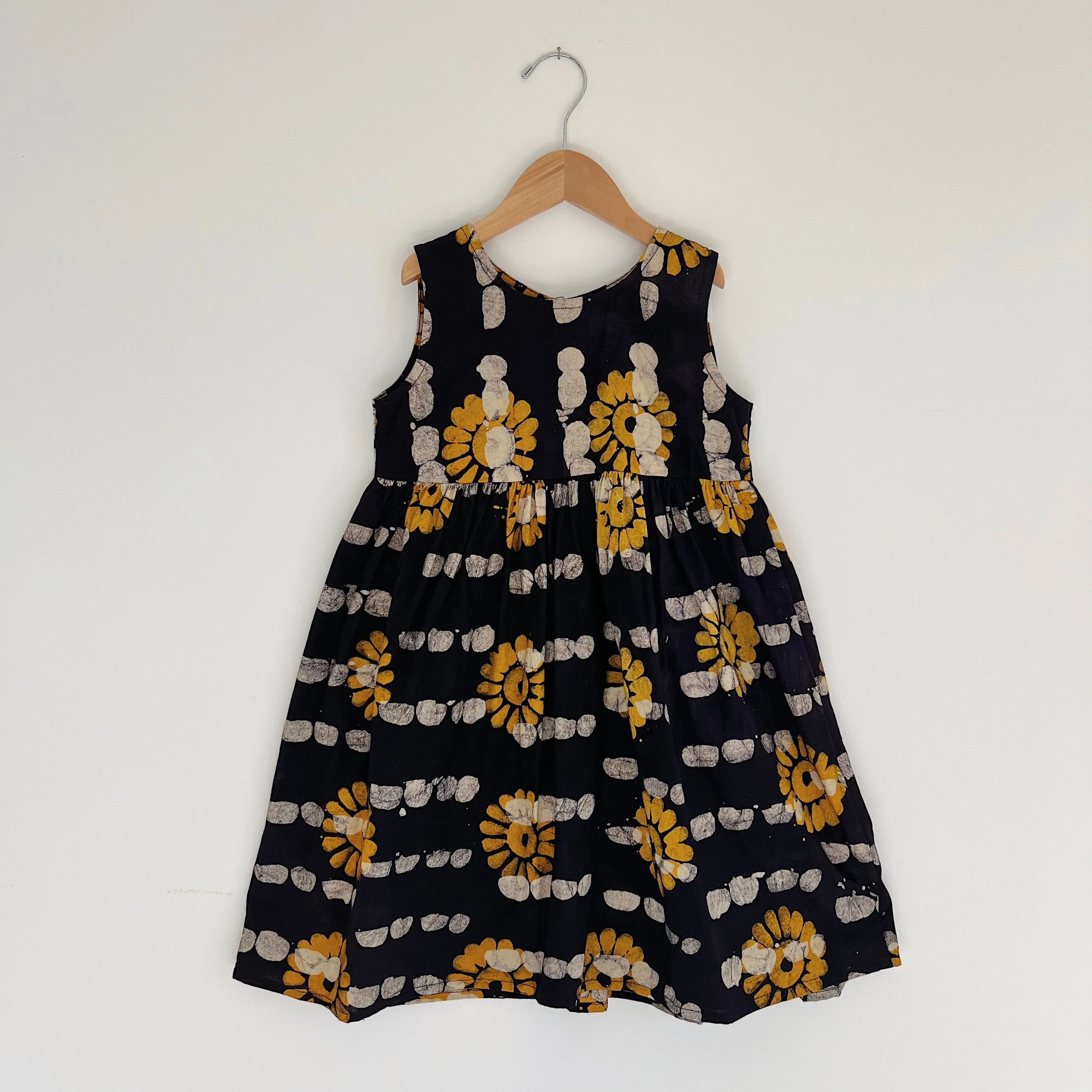 Fahari Bazaar | Girls Tank Dress in Yellow Sunflower Over Navy Print