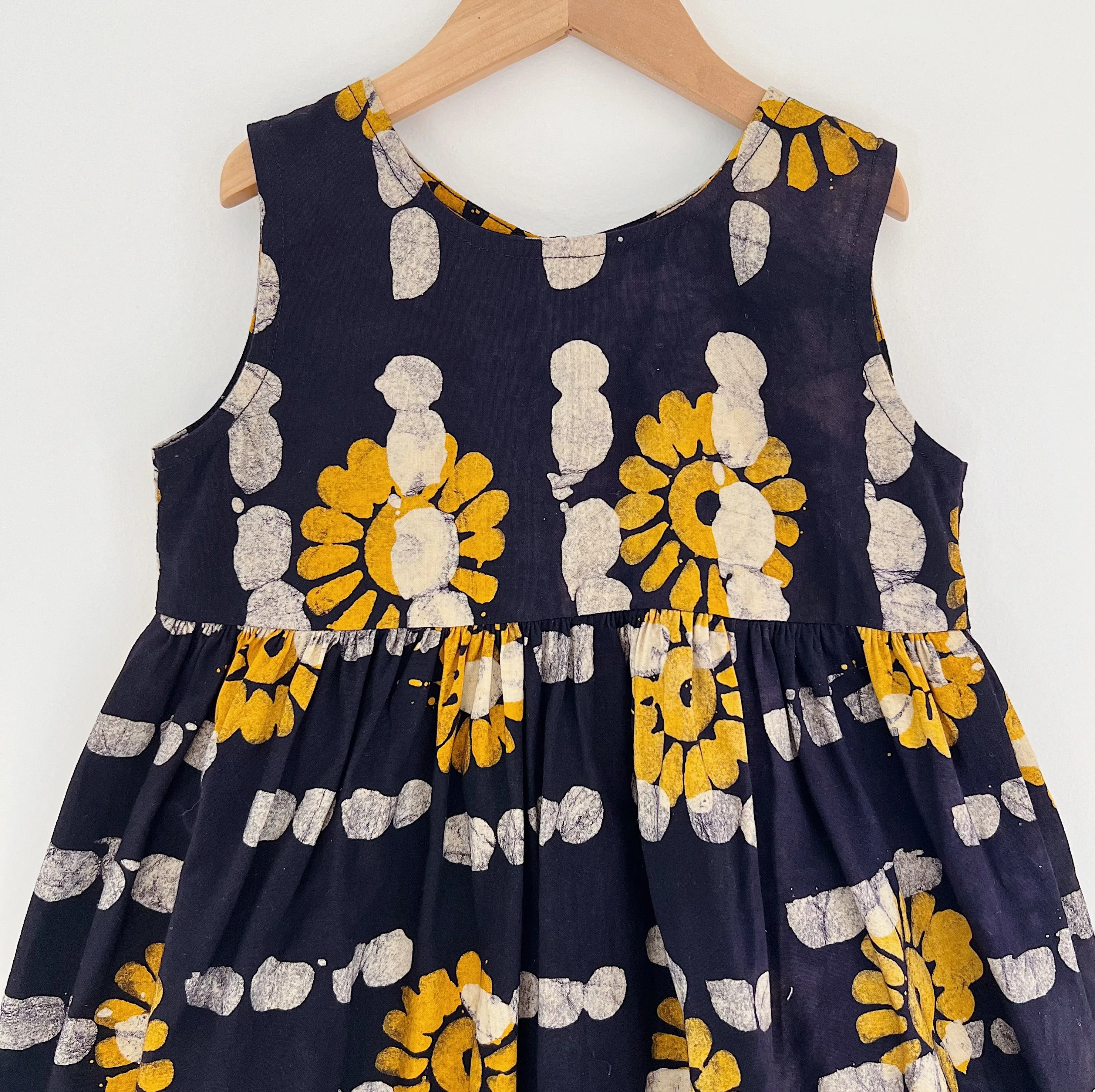 Fahari Bazaar | Girls Tank Dress in Yellow Sunflower Over Navy Print